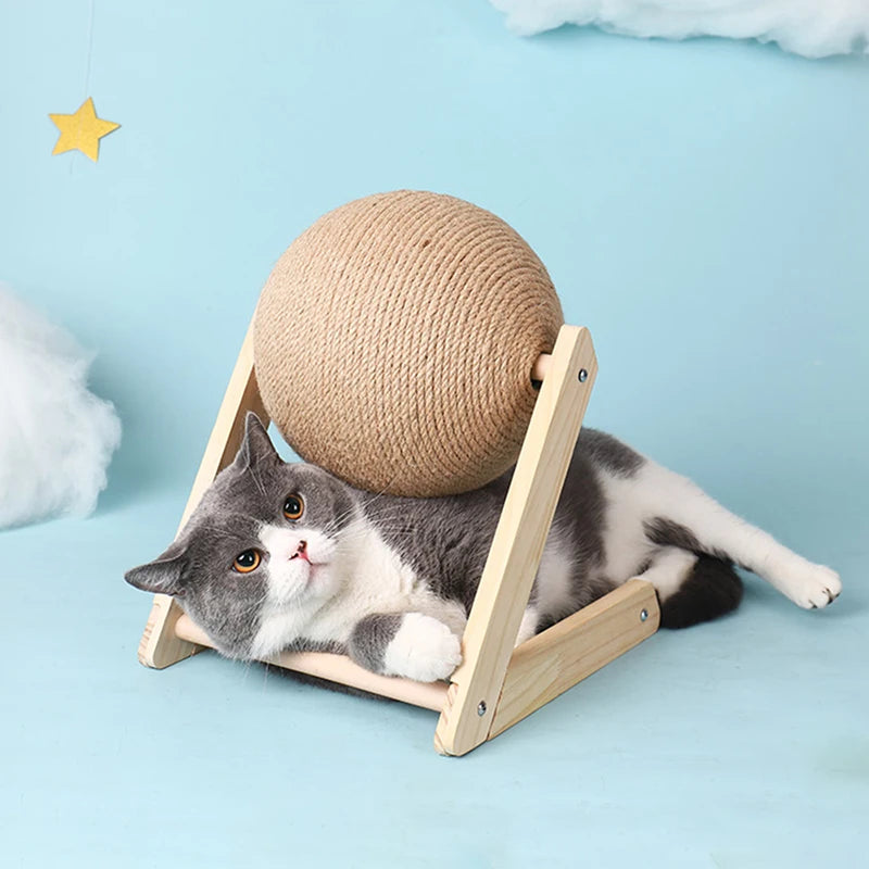 Cat lying on a wooden platform with a spherical rope toy above it against a light blue background
