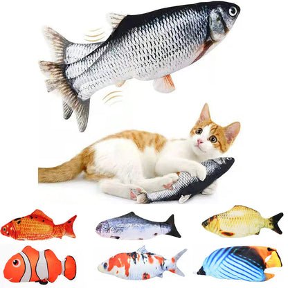 Cat playing with a fish-shaped toy on a white background