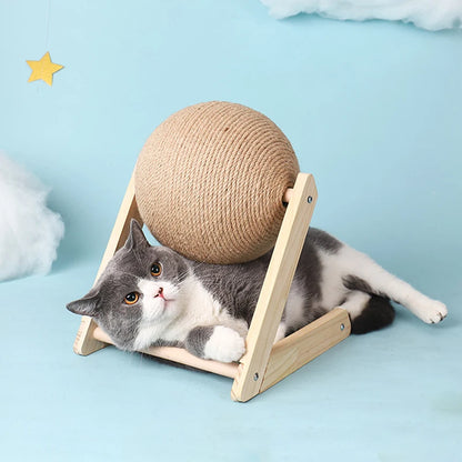 Cat lying on a wooden platform with a spherical rope toy above it against a light blue background.