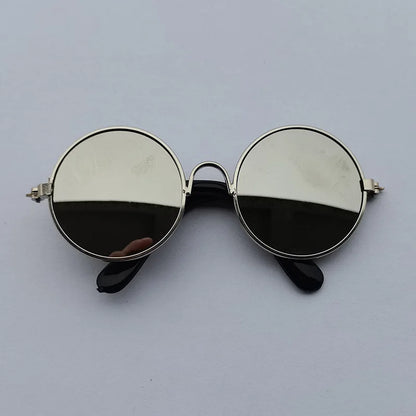 Round sunglasses with reflective lenses on a light gray background
