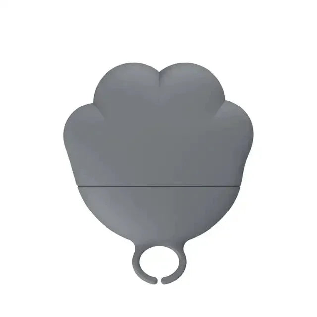 Gray heart-shaped object with a ring on a white background