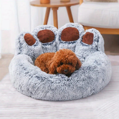 Dog lying on a gray paw-shaped pet bed in a cozy room.