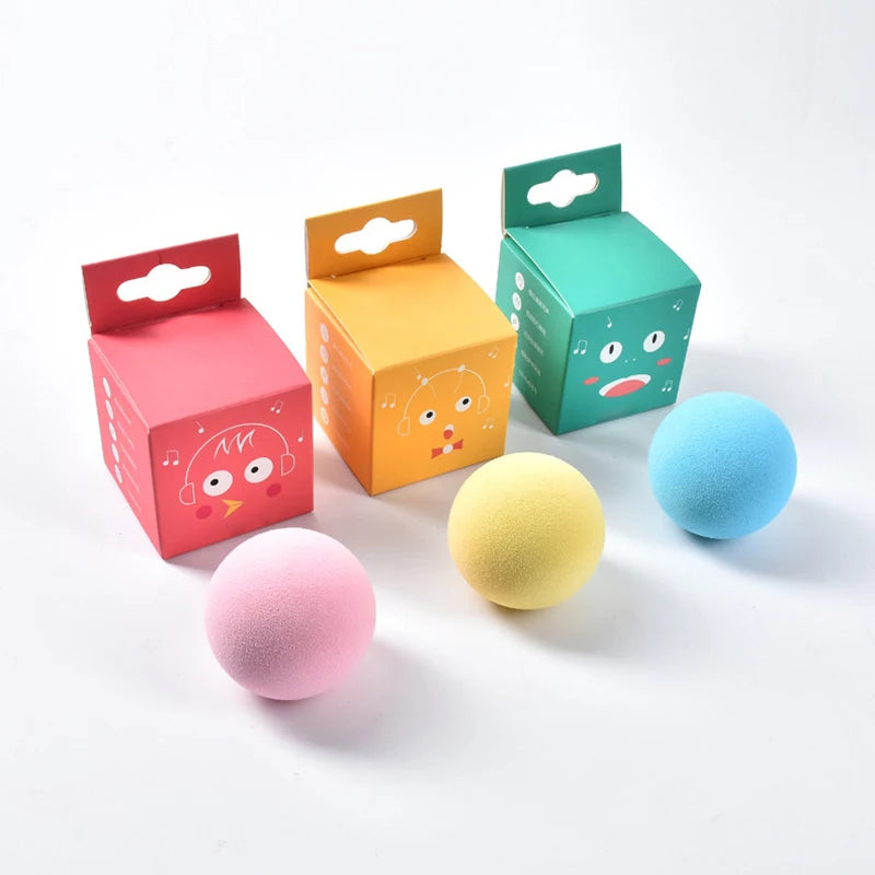 Colorful boxes with cartoon faces and matching colored balls on a white background