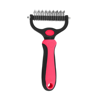Pet grooming brush with pink handle and black metal teeth on a white background