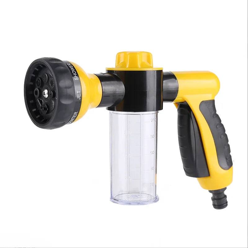 Yellow and black spray gun with various nozzles on a white background