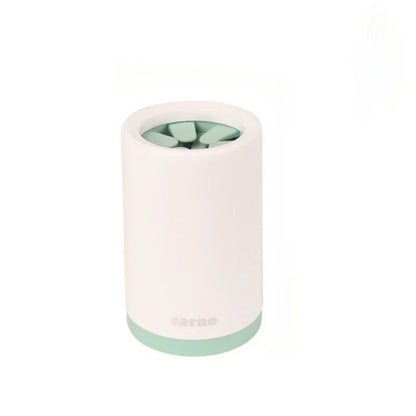 White and green cylindrical product with 'Nespresso' branding on a white background