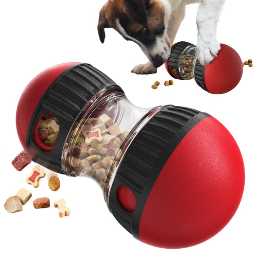 Red and black dog toy with food dispenser and a dog interacting with it.