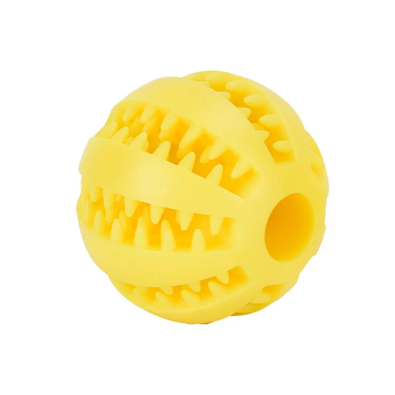 Yellow rubber ball with textured surface on a white background