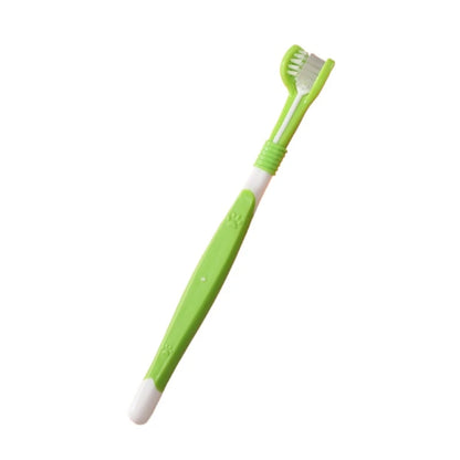 Green and white toothbrush on a white background