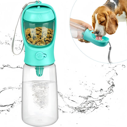 Turquoise pet water bottle with food compartment and dog drinking from it on a white background