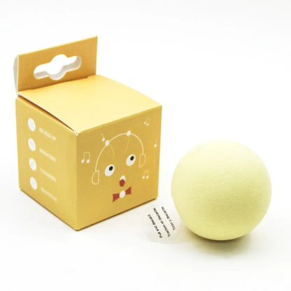 Yellow bath bomb with packaging on a white background