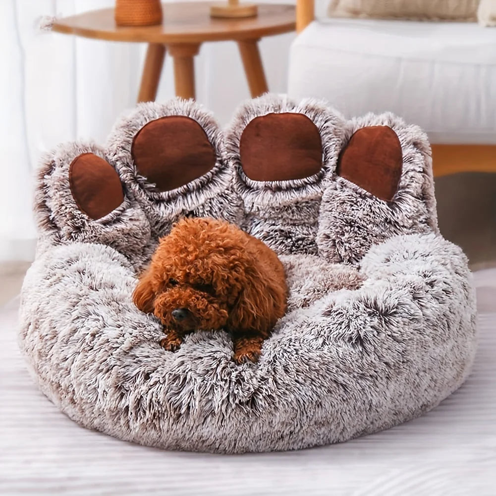 Fluffy pet bed with bear ears and a small brown dog inside, in a cozy living room setting.