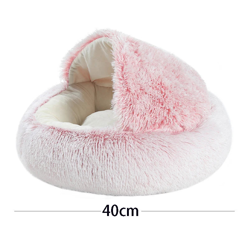 Fluffy pink pet bed with measurement label on a white background
