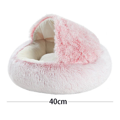 Fluffy pink pet bed with measurement label on a white background
