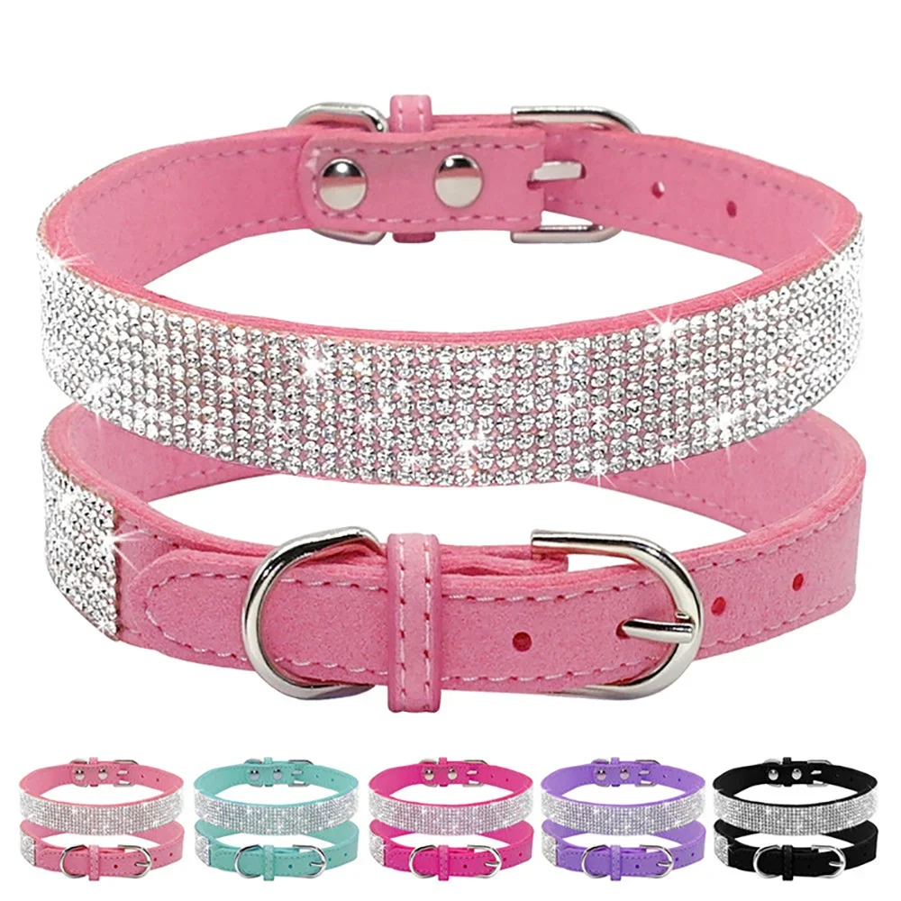 Pink dog collar with rhinestone detailing on a white background