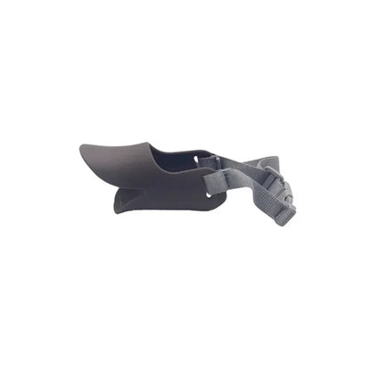 Dark gray dog muzzle with a strap on a white background