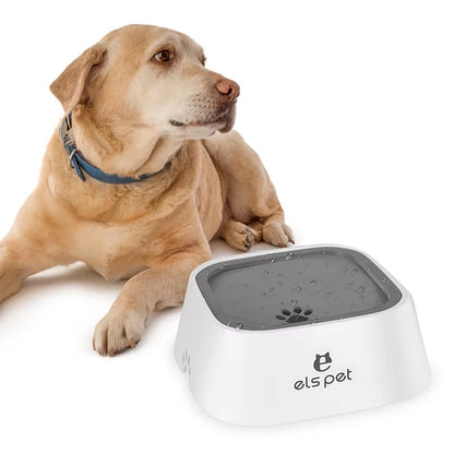 Dog sitting next to a white pet water bowl with a gray top on a white background, featuring the 'els pet' brand.