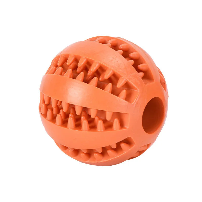Orange rubber ball with textured surface on a white background