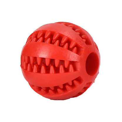 Red rubber dog toy ball with textured surface on a white background