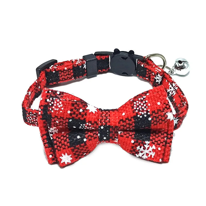 Red and black checkered bow tie with snowflakes on a white background