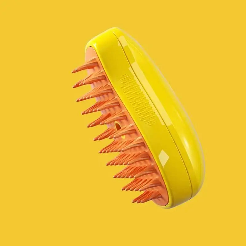 Yellow hairbrush with orange bristles on a yellow background