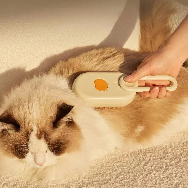 Person using a pet grooming brush on a fluffy cat