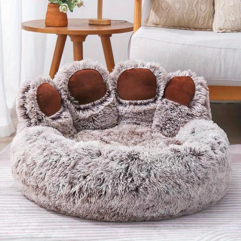Fluffy pet bed with brown accents on a striped rug
