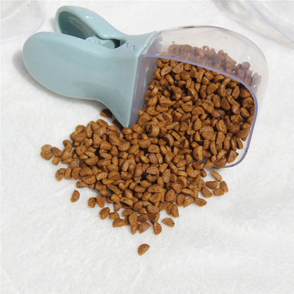 Pet food scoop with dry cat food on a white background
