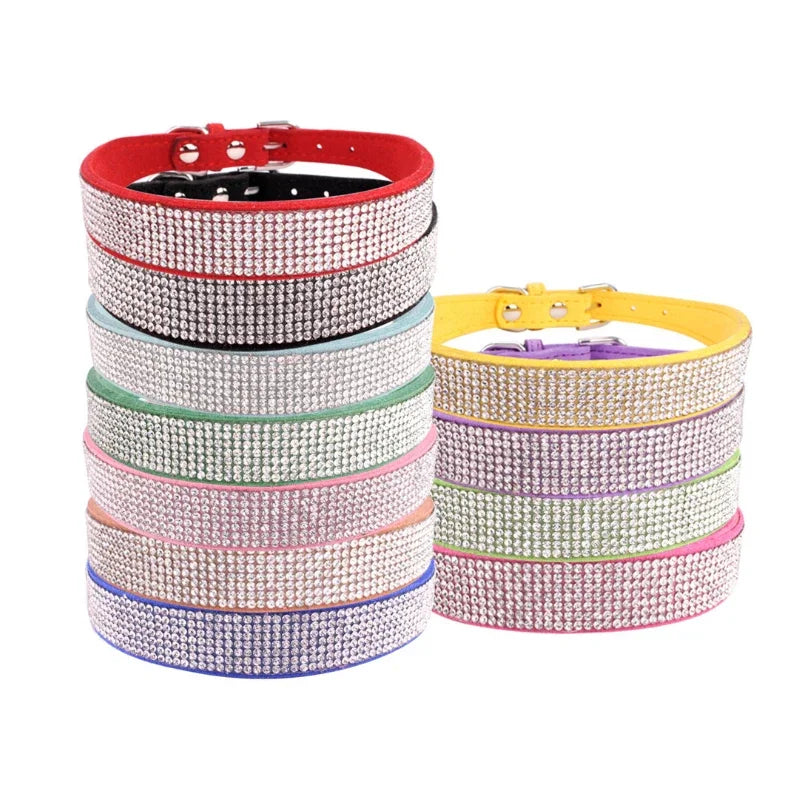 Stacks of colorful rhinestone dog collars on a white background