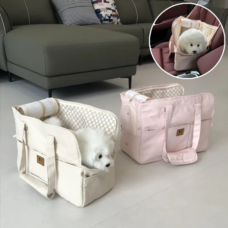 Two pet carriers, one beige and one pink, with small dogs inside on a light-colored floor.