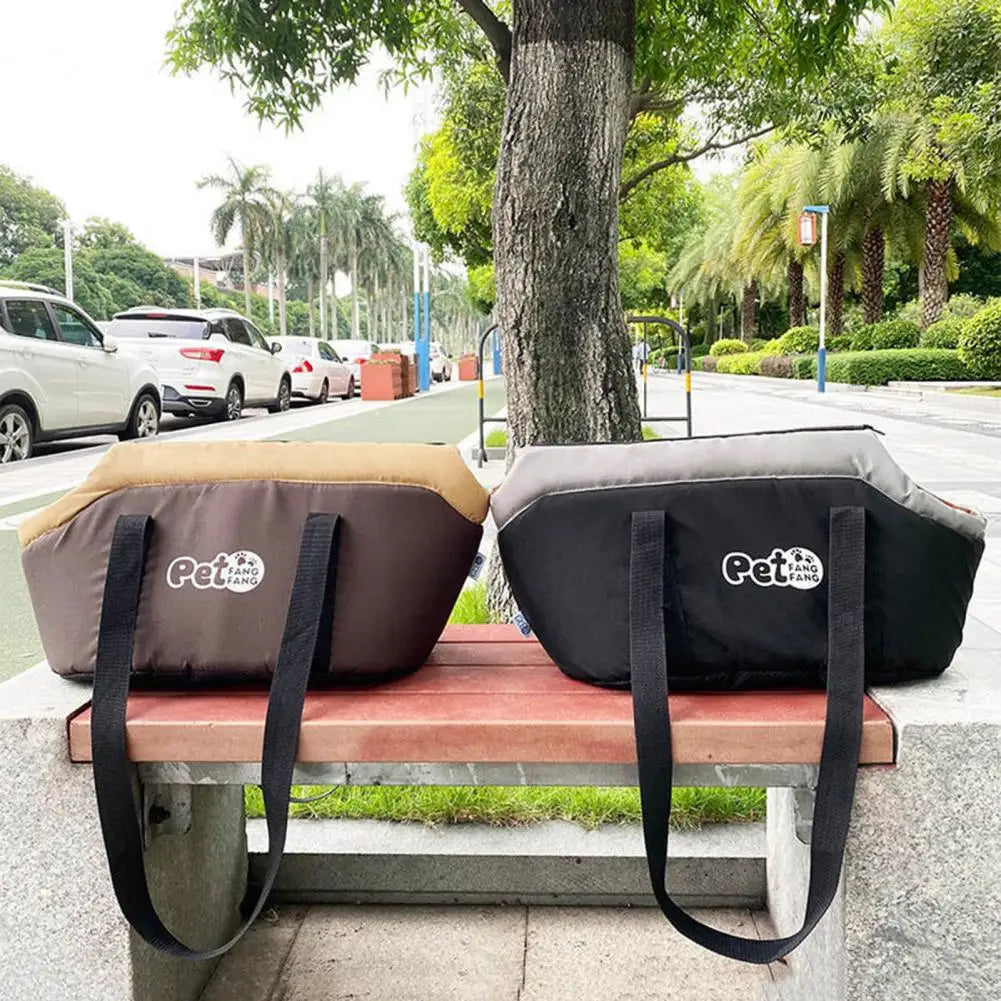 Two pet bags with 'Pet Fans' branding on a bench outdoors.