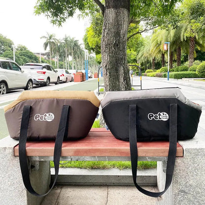 Two pet bags with 'Pet Fans' branding on a bench outdoors.
