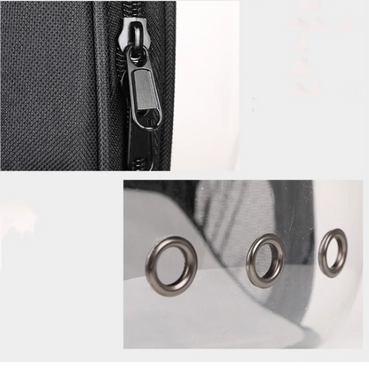 Close-up of a zipper on a black bag and metal grommets on a white background.