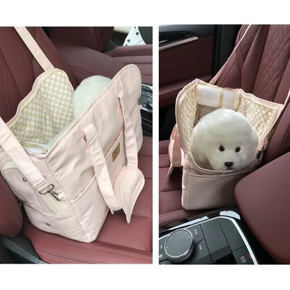 Pet carrier for small animals in a car seat, with a white fluffy animal inside.