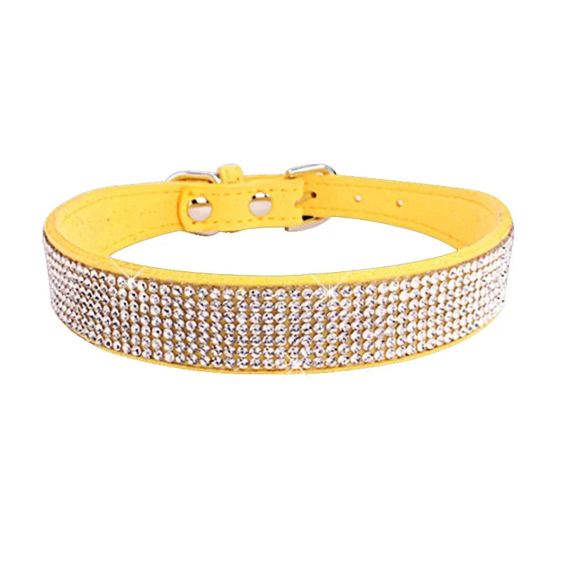 Yellow dog collar with rhinestone detailing on a white background