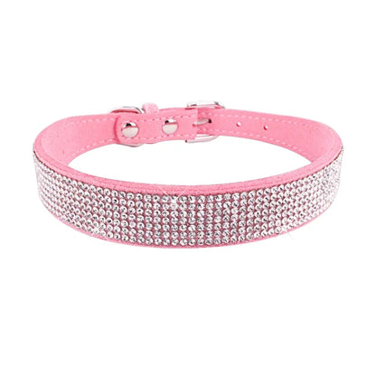 Pink dog collar with rhinestones on a white background