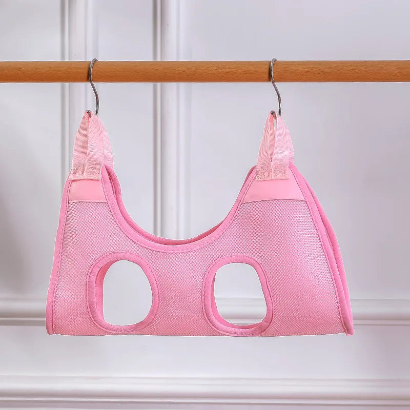 Pink baby carrier on a wooden rod against a white background