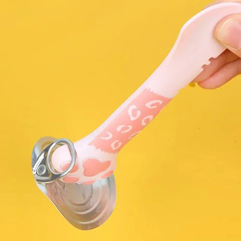 Pink bottle opener with heart patterns on a yellow background
