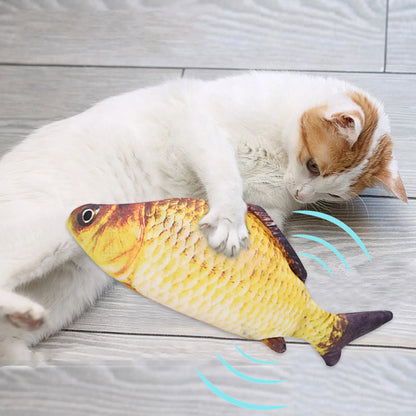 Cat playing with a fish-shaped toy on a wooden floor