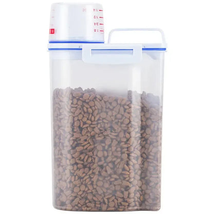 Clear plastic container with pet food and a measuring cup on a white background